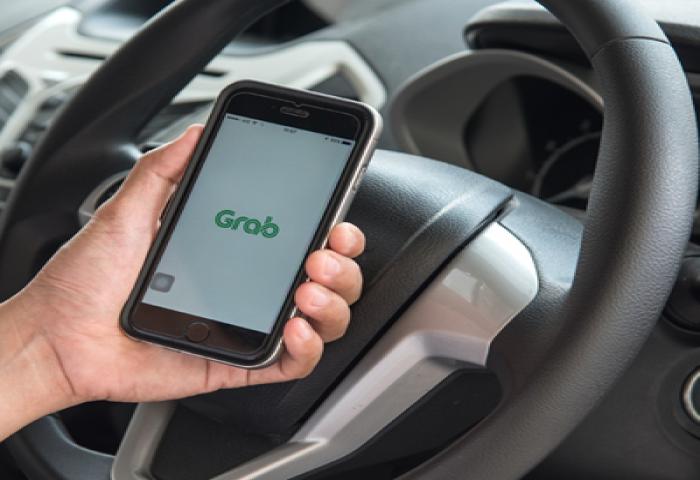 Garuda Indonesia dan Grab Jalin Kolaborasi